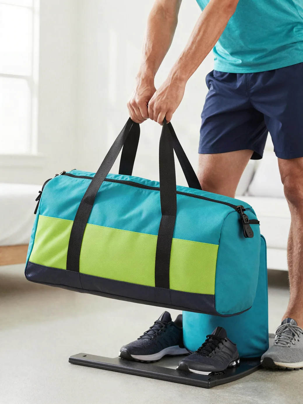 Athlete carrying a bright Brance gym bag